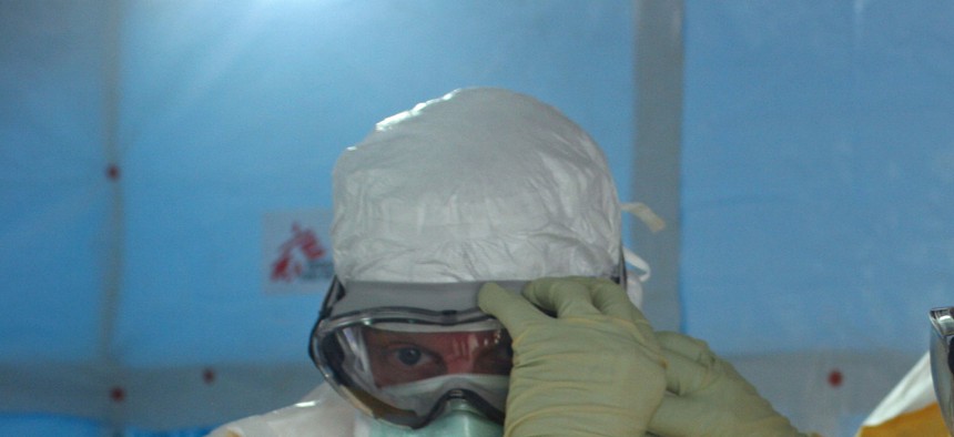 Doctors get ready to enter the Ebola unit in Liberia in August.