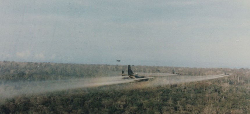 Group of U.S military C-123 aircraft spray Agent Orange during the Vietnam War.