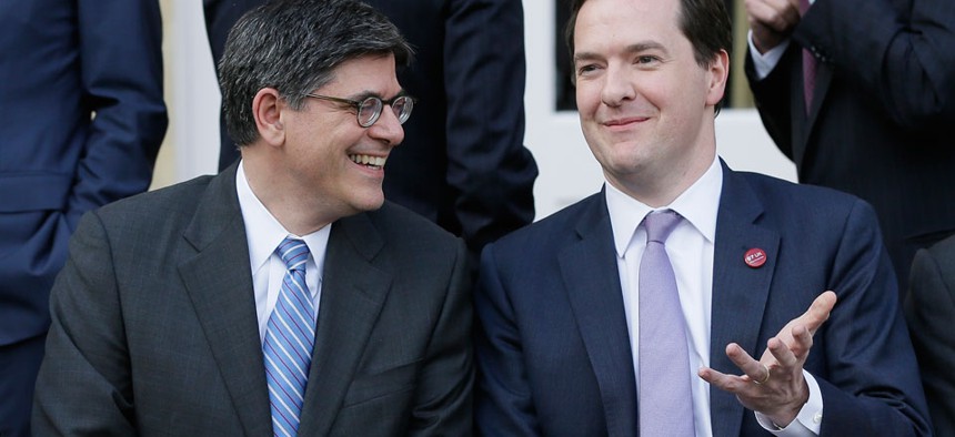 Lew Jacob, left, with George Osborne Britain's Chancellor of the Exchequer, as they take part in the group photo for the G7 finance ministers and central bank governors in 2013.