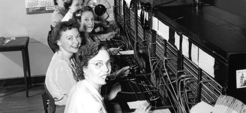 Telephone operators work in Seattle in 1952.