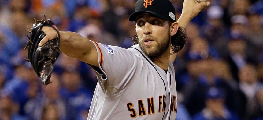 Series MVP Madison Bumgarner pitches during the World Series last week.