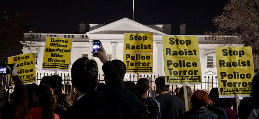 Protestors rally outside the White House Monday night.