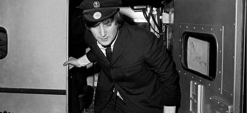 John Lennon arrives for a concert in Houston in August 1965. 