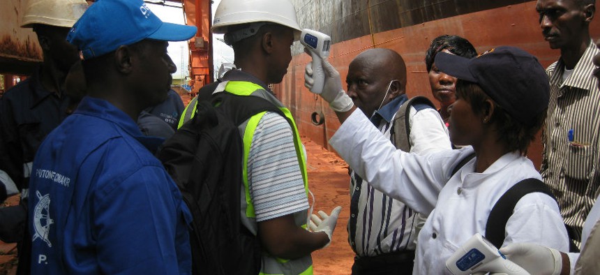 A team from CDC observes health screening at the Conakry Maritime Port in Guinea.