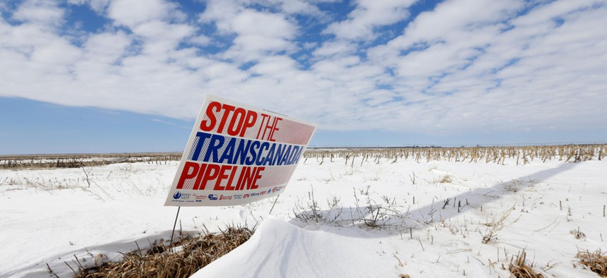 A sign protesting the Keystone XL pipeline stands in Nebraska in 2013.
