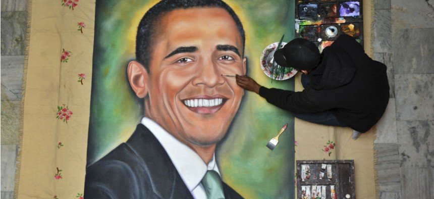 Indian artist Jagjot Singh Rubal finishes a painting of Obama in preparation for the president's visit. 