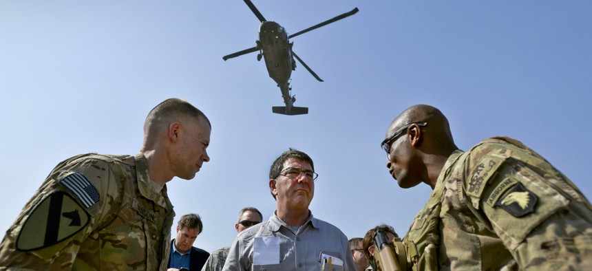 Then-Deputy Secretary of Defense Ashton Carter speaks with service members in Afghanistan, May 2013.