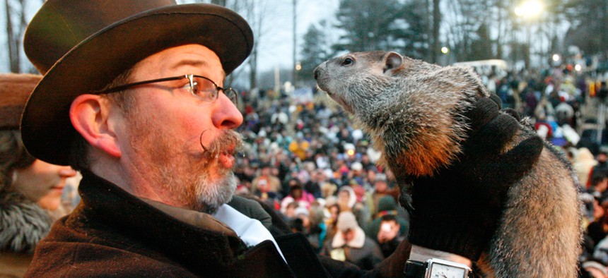 Punxsutawney Phil, held by Ben Hughes in 2010, is famous for predicting more of the same.