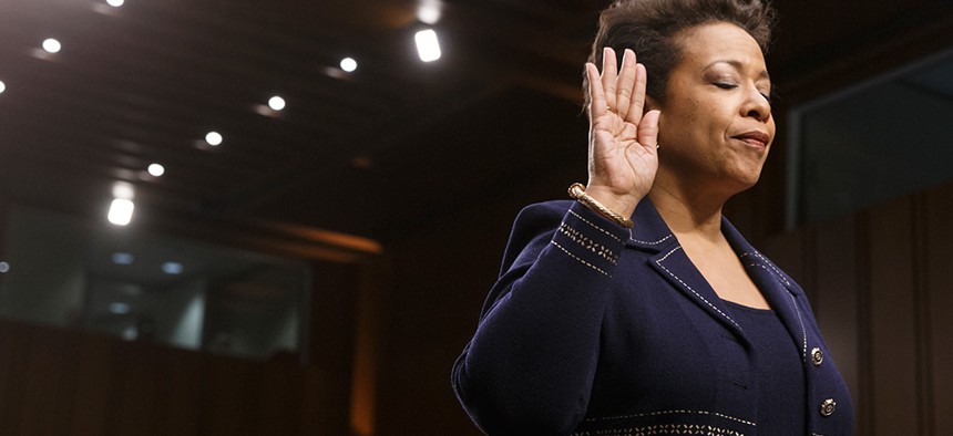  Loretta Lynch closes her eyes as she finishes being sworn in to testify before the Senate Judiciary Committee in January. 