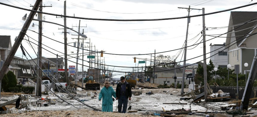 Residents walk in Seaside Heights, N.J., days after Hurricane Sandy made landfall Oct. 29, 2012.