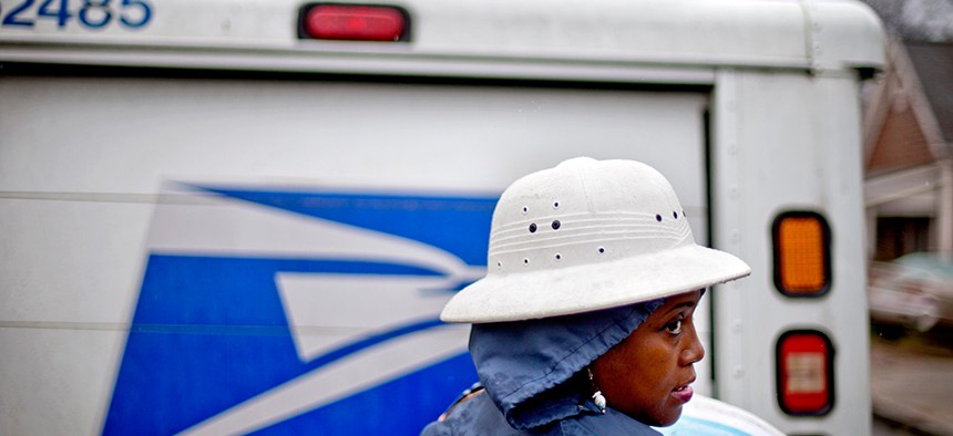 Jamesa Euler delivers mail in Atlanta in 2013.