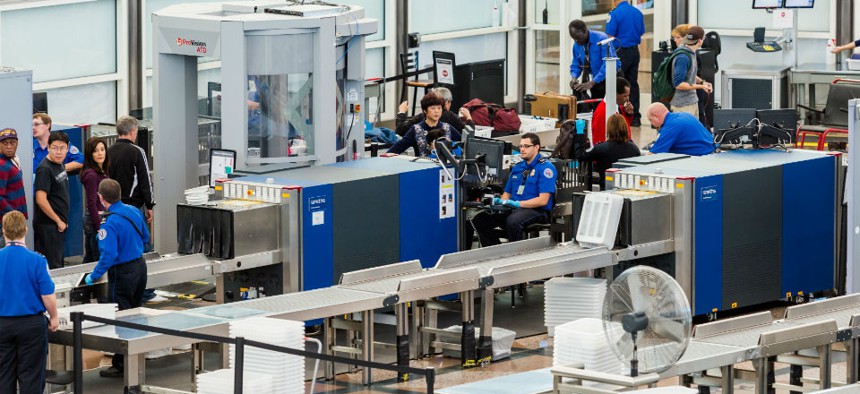 TSA screeners on the job at Denver International Airport.