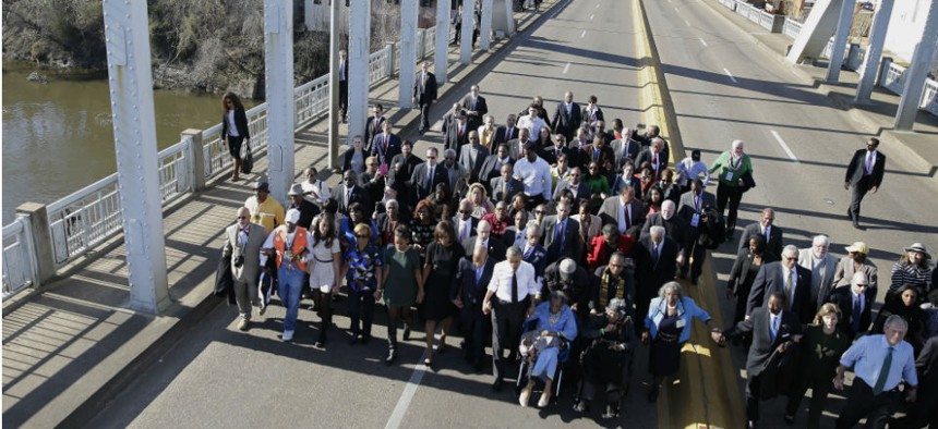 President Obama, former president George W. Bush and civil rights leaders walk across the Edmund Pettus Bridge in Selma, Ala., to mark the 50th anniversary of "Bloody Sunday." 