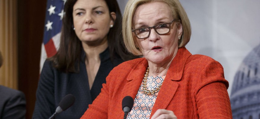 Sens. Kelly Ayotte, R-N.H., (left) and Claire McCaskill, D-Mo., want to "abolish" the agency. 