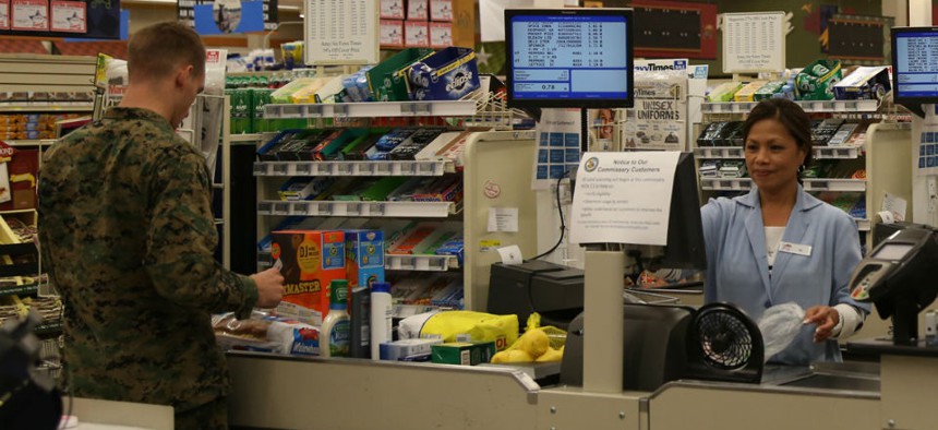 A customer checks out at the commissary at Marine Corps Air Station New River, N.C. 