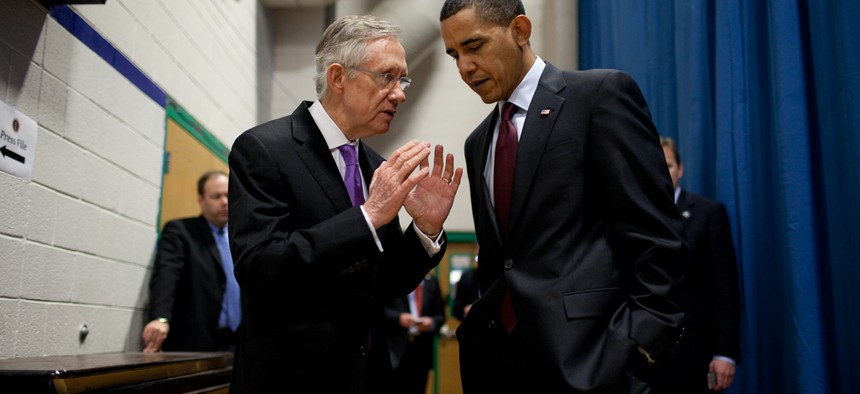 Obama and Reid speak in 2010.