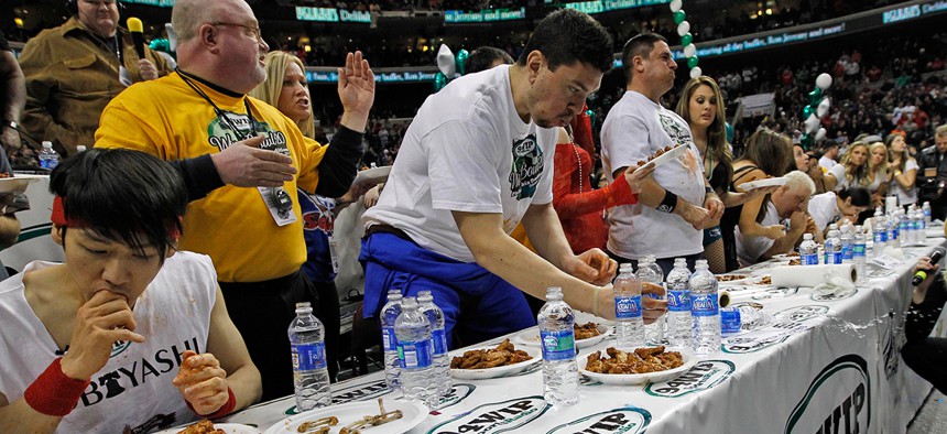 Competitive eaters feast on wings during the 2012 Wing Bowl in Philadelphia.