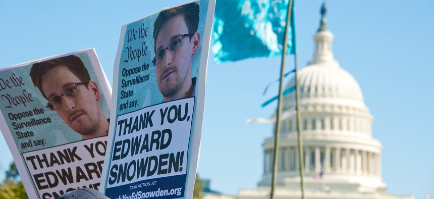 Protestors rally in support of Edward Snowden in 2013. 