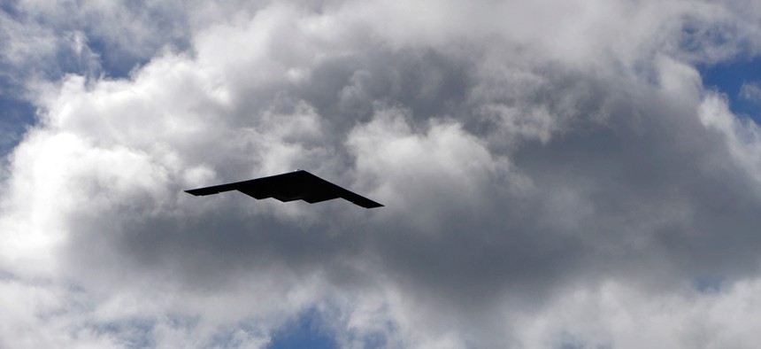 A B-2 Spirit strategic bomber conducts a low approach training flight over Hickam Air Force Base, Hawaii.