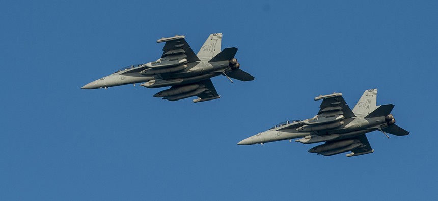 Two EA-18G Growlers from the Cougars of Electronic Attack Squadron conduct a flight test in November.