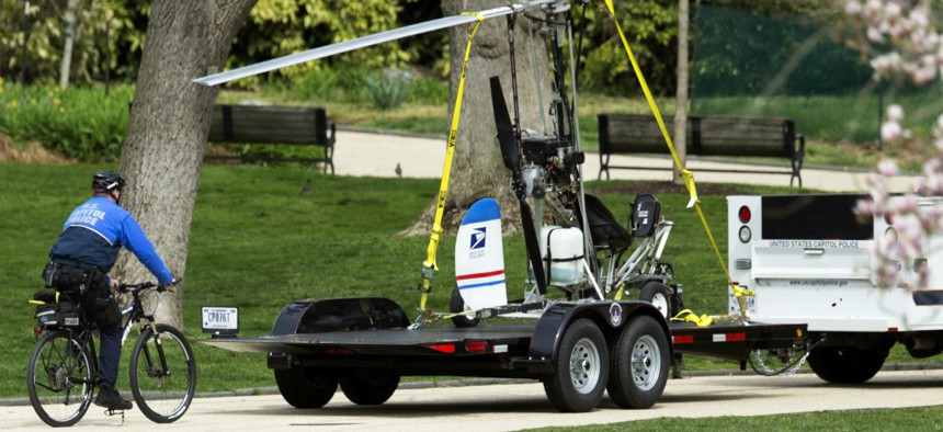 Capitol Police haul away the gyrocopter a U.S. Postal Service worker was able to land on the Capitol lawn earlier this week. 