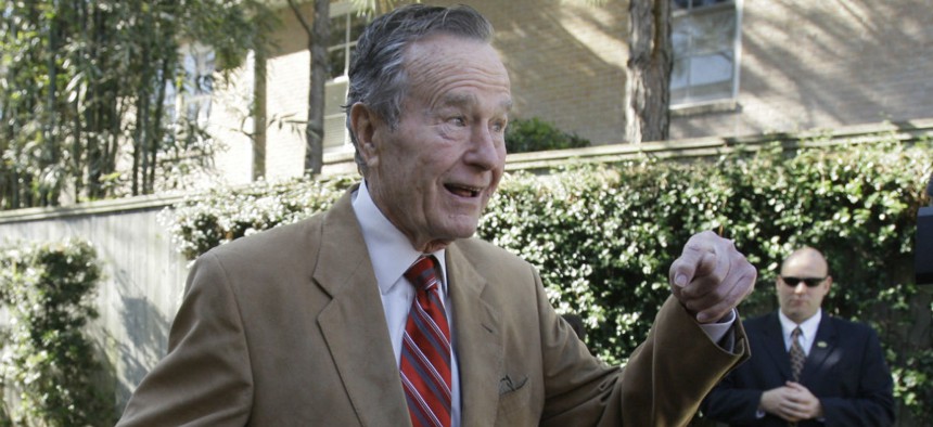 Former president George H.W. Bush stands outside his home in Houston in 2010. 