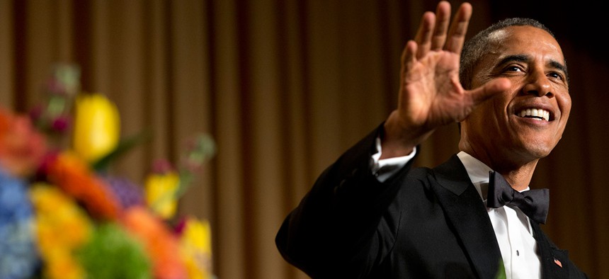 Obama waves during the 2014 White House Correspondents' Association Dinner.