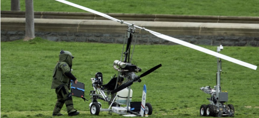 A bomb squad member checks the gyrocopter that a U.S. Postal Service worker landed on the lawn of the Capitol on April 15. 