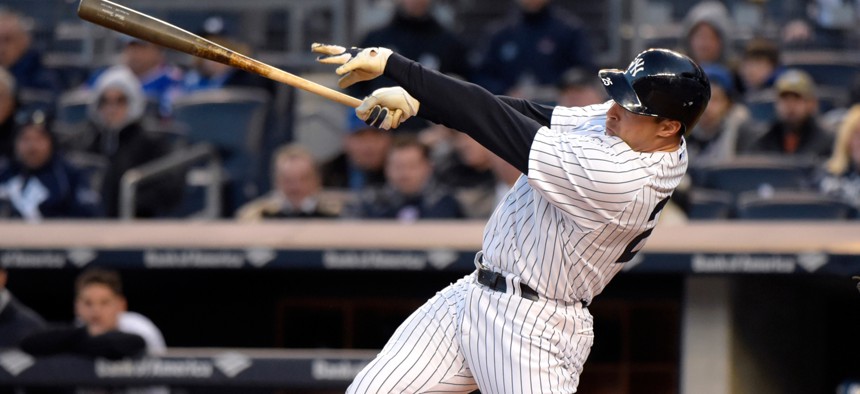New York Yankees' Mark Teixeira hits a two-run home run during a game Friday.