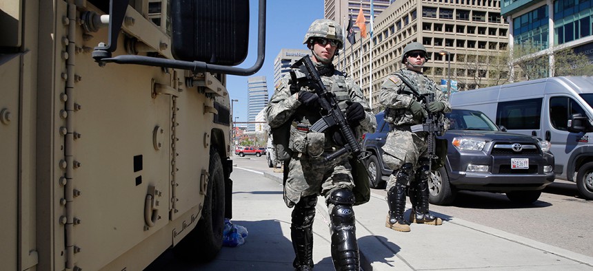 Maryland National Guardsmen patrol in downtown Baltimore Tuesday.