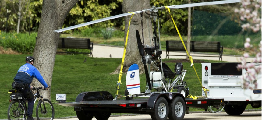 Capitol Police remove the small helicopter that Florida mail carrier Doug Hughes was able to land on the Capitol lawn April 15. 