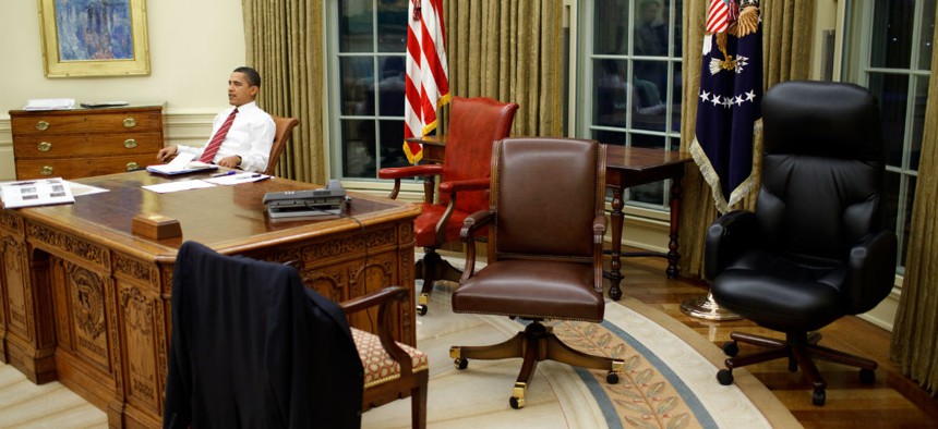 President Obama tries out different office chairs soon after being sworn in as President in 2009.