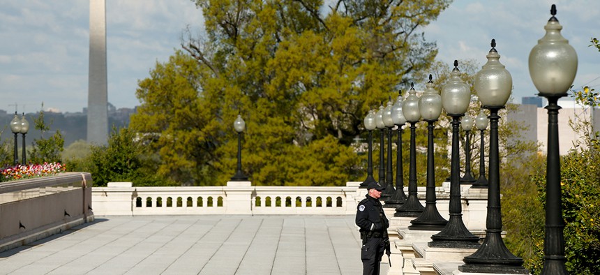 A Capitol Hill Police officer stands outside the Capitol in April.
