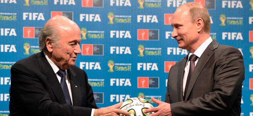  FIFA President Sepp Blatter, left, and Russian President Vladimir Putin are seen during the official ceremony of handover to Russia as the 2018 World Cup hosts in Brazil last summer. 