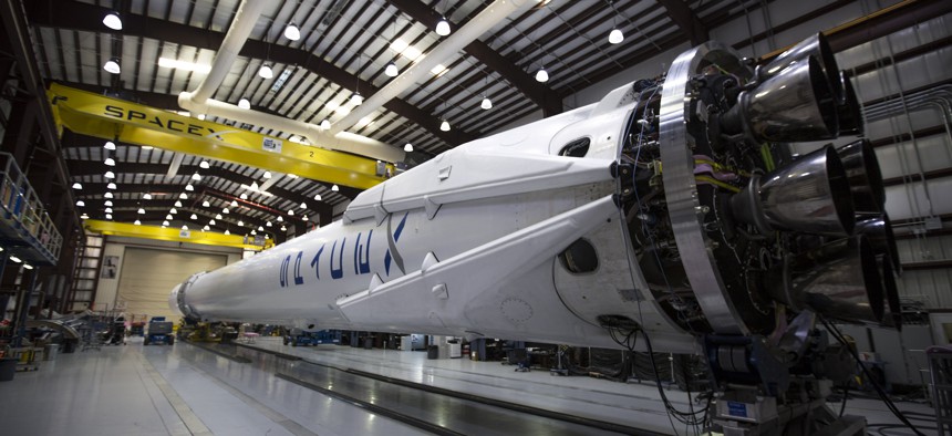 The CRS-6 Falcon sits in a hangar.