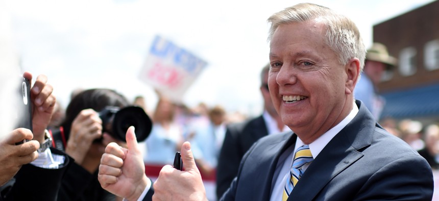 Graham greets supporters after his announcement Monday.
