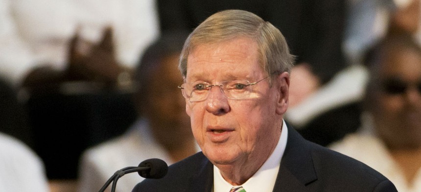 Sen. Johnny Isakson, shown speaking at the Ebenezer Baptist Church in Atlanta in January, sponsored the legislation to compensate surviving hostages and their families.