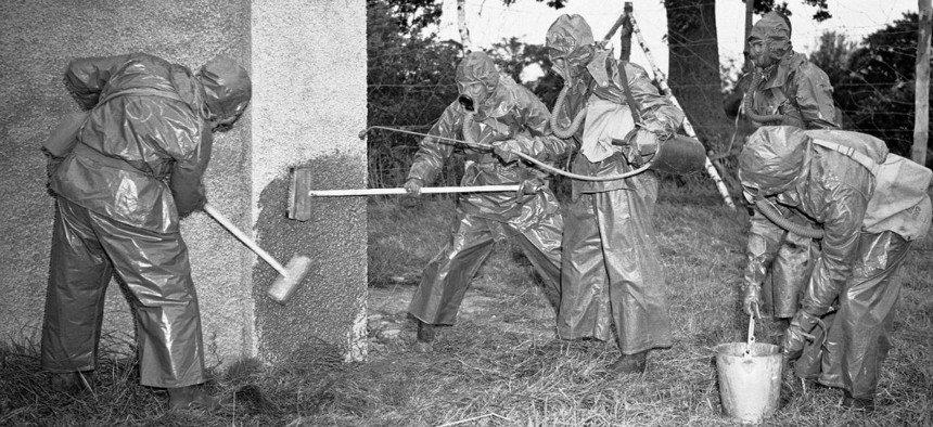 Students at an Army officer training school in England decontaminate the facility after a simulated mustard gas attack in 1942.
