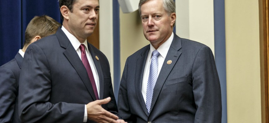 Reps. Jason Chaffetz and Mark Meadows confer after a hearing in September 2014. The two got in a fight over Meadows' vote on fast-track trade authority, but on Thursday announced they had reconciled. 