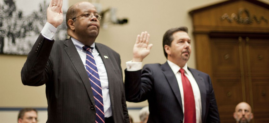 TIGTA J. Russell George (left) and deputy Tim Camus are sworn in before the House Oversight and Government Reform Committee. 