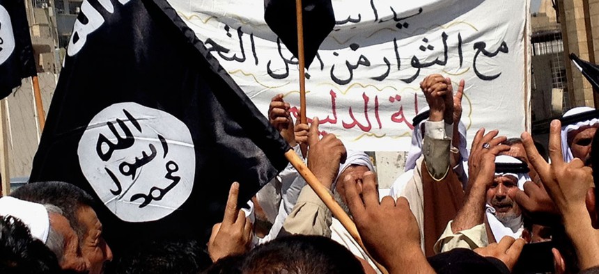 Demonstrators in support of the Islamic State rally in Mosul in 2014.