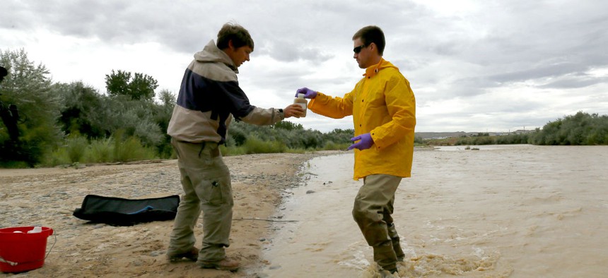 State officials take a sample from the San Juan River in Utah, which was affected by the spill. 