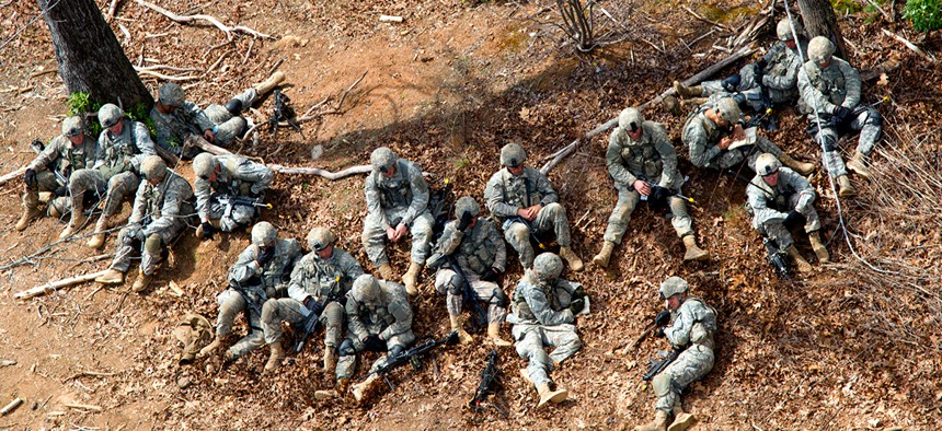 Ranger students rest during medical evacuation training in Georgia.