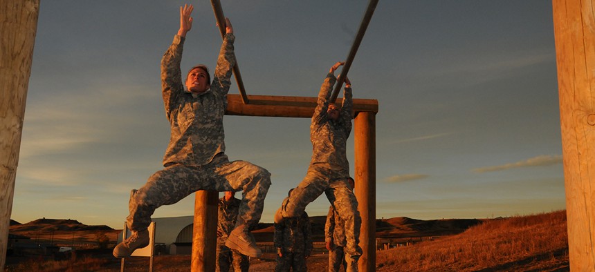  Shaye Haver, left, traverses an obstacle during the Ranger Assessment held at Fort Carson in October.