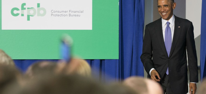 President Obama announces a plan to strengthen security for debit cards that transmit federal benefits, in October 2014. 