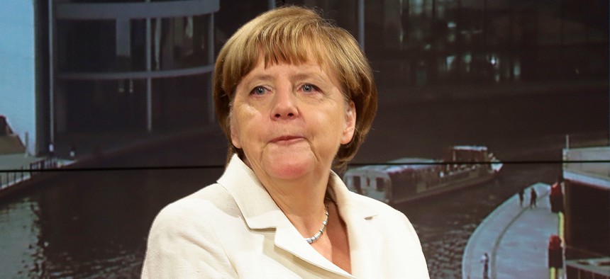 Angela Merkel prepares in a studio before a television appearance  in July. 