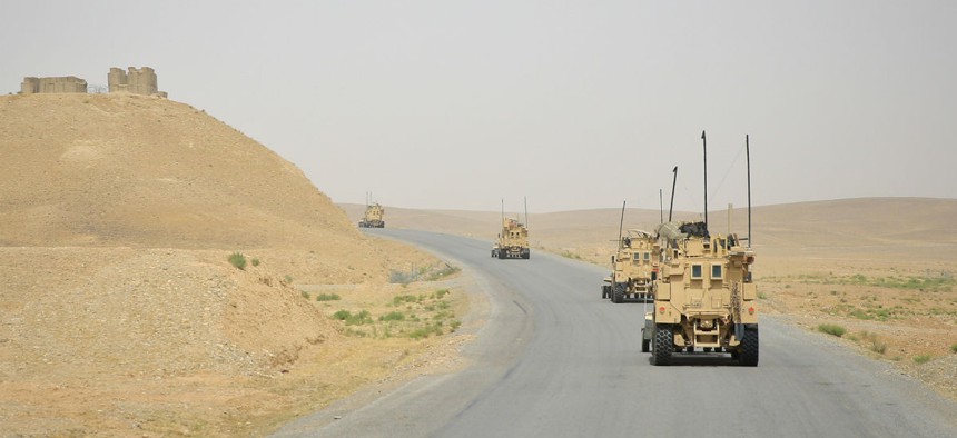 A Marine Corps convoy travels through Afghanistan in May 2014.