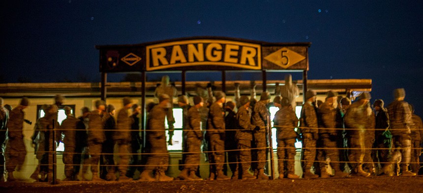 Ranger students from Charlie Company, 5th Ranger Training Battalion do pull-ups before breakfast at "Mountain Phase" in 2014.