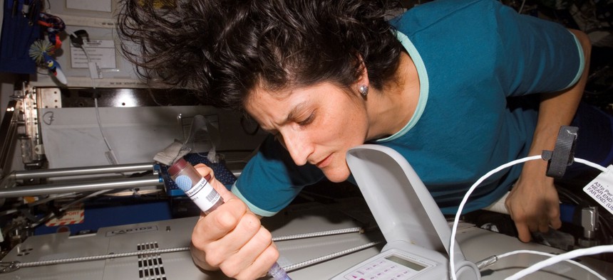 NASA astronaut Suni Williams works on the International Space Station in 2007.