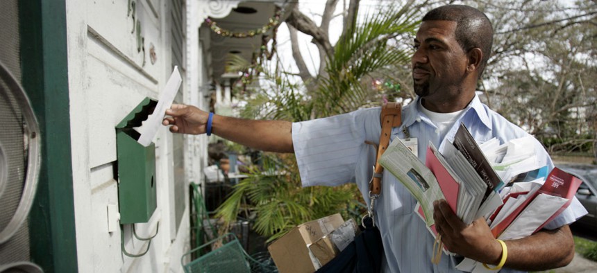 Mailman Randy Ramie delivers mail Feb. 23, 2006, in New Orleans.